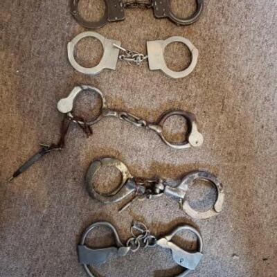 1216	

5 Pairs Of Vintage Handcuffs
5 Pairs Of Vintage Handcuffs
