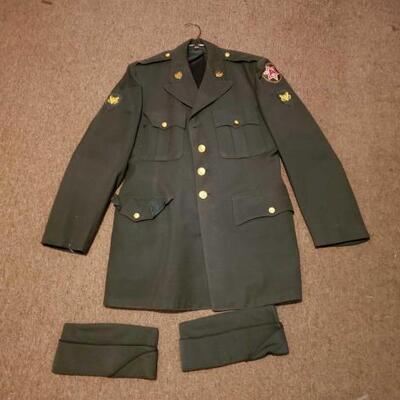 1310	

Military Coat And 2 Covers
Military Coat And 2 Covers