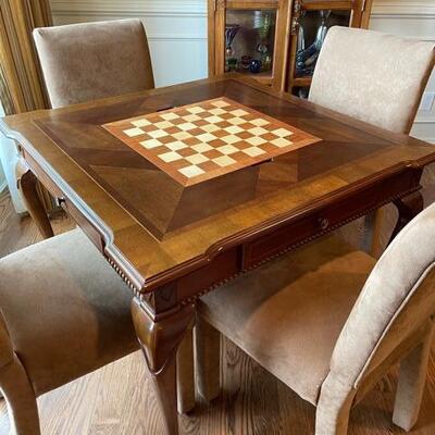 $250 set - Game table w/ 4 ultra suede parsons chairs - Table has reversible game board & 2 drawers. Table size 38