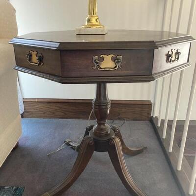 This mahogany one drawer octagon side table measures 26