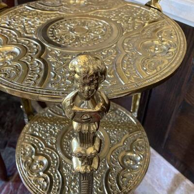 Three shelf Brass stand with lovely cherub detail.  29