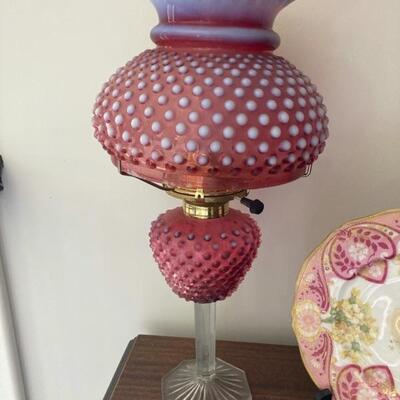 Cranberry glass hobnail lamp with globe.  Priced at $125