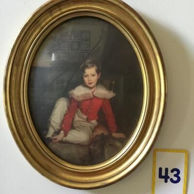 #43 Oval frame with print of boy 14" x 17" Priced at $65