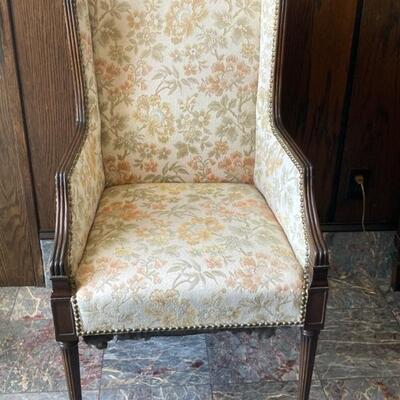 Straight back upholstered chair is one of a set. Priced at $50 each.