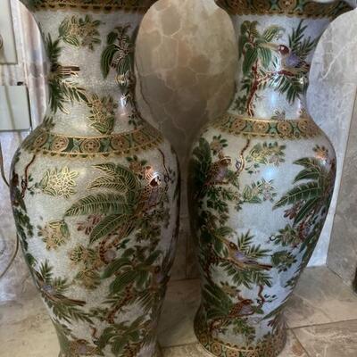 Beautiful pair of oriental style floor vases. Stamped CHINA on bottom. They stand 23