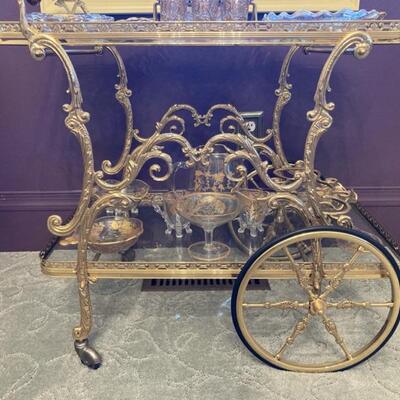 This Brass & Glass tea cart is exceptional.  Top shelf measures 28