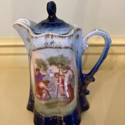 Nippon hand painted pitcher with lid.  Priced at $45