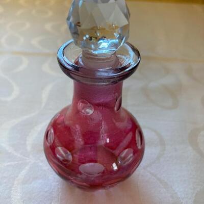 Small cranberry cruet with clear glass stopper.  Priced at $55