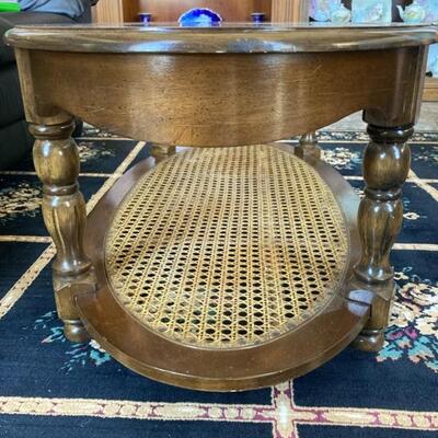 Oval glass top Coffee table with caned lower shelf.  Priced at $75