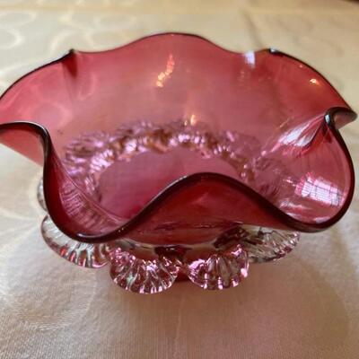 Small cranberry dish with clear glass trim.  Priced at $45