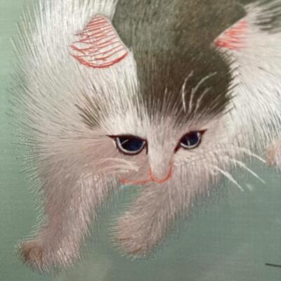 Showing exquisite detail in cat needlework