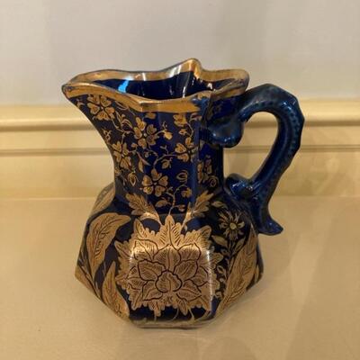 Cobalt blue 5" pitcher with heavy gold overlay.  Priced at $45