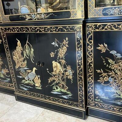 Oriental Chinoiserie Cabinet shows raised detail on the cabinet doors. Cabinet priced at $1,500.