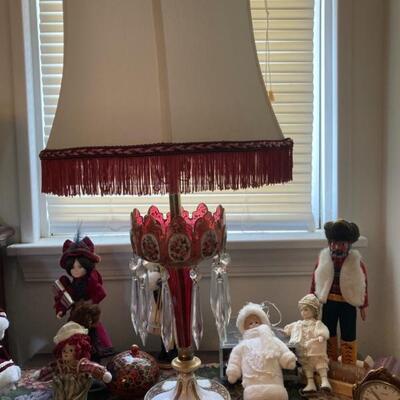 Beautiful cranberry glass lamp with clear crystal prisms.  Custom shade.  Priced at $135.
