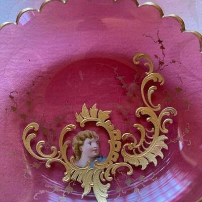 Set of 8 Cranberry 5" plates with handprinted gold Cherubs. Priced at $125