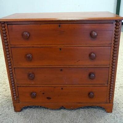 1057	4 DRAWER ANTIQUE CHEST HAS BOBBIN TURNED HALF COLUMNS, & SCALLOPED SKIRT. 38 IN W, 35 IN H 17 IN DEEP
