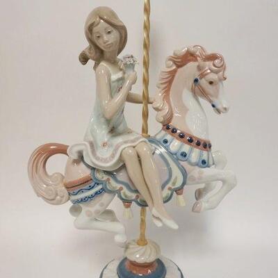 1124	LLADRO YOUNG GIRL ON CAROUSEL 15 IN 
