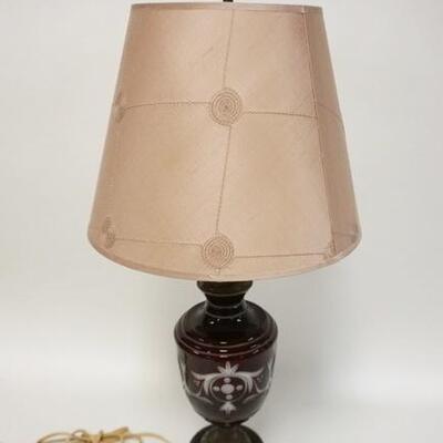 1139	RUBY CUT CASED TABLE LAMP ON METAL BASE. 26 IN H 
