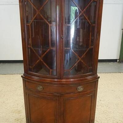 1077	DREXEL *NEW TRAVIS COURT COLLECTION* CORNER CABINET, BOWFRONT, BLIND BASE. 68IN H 36 IN W 21 IN DEEP
