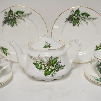 1183	8 PIECES OF LILY OF THE VALLEY BONE CHINA, A TEAPOT; 6 IN H, TWO CUPS, TWO SAUCERS & TWO 8 1/2 IN PLATES
