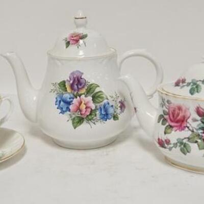 1187	LOT OF TWO BONE CHINA CHINA TEAPOTS & A CUP & SAUCER TALLEST POT IS 7 1/2 IN 
