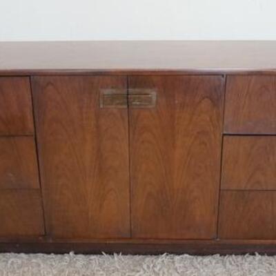 1040	MID CENTURY MODERN SERVER HAVING 10 DRAWERS, 4 CONCEALED BEHIND 2 DOORS, EXTERIOR HANDLES ARE COPPER, 179 IN X 19 IN X 28 IN HIGH
