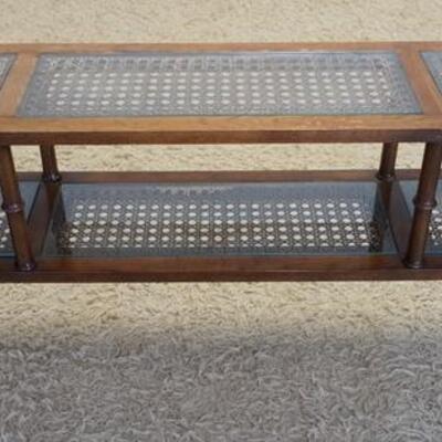 1096	WALNUT 2 TIER SHELF NARROW CANE INSET W/ GLASS TOPS MADE BY FLAIR FUNRITURE. 60 IN X 10 IN, 27 IN H 
