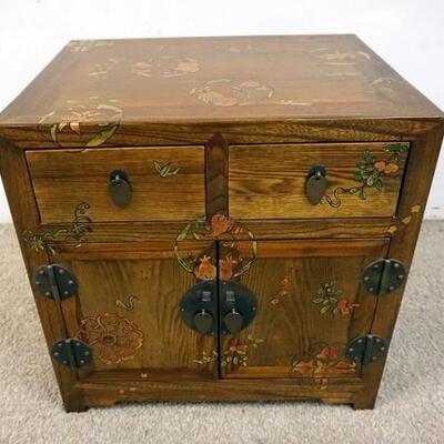 1072	SMALL PAINT DECORATED ASIAN STAND HAS 2 DOORS & 2 DRAWERS. 20 IN W, 16 IN DEEP, 19 1/2 IN DEEP 
