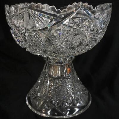 1181	AMERICAN BRILLIANT CUT GLASS PUNCH BOWL. 2 PIECES HAS ONE TOOTH OFF THE TOP RIM & MULTIPLE CHIPS ON THE BOTTOM RIM OF THE BASE. 12...