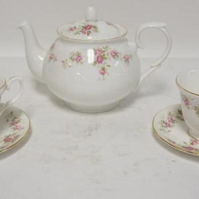 1184	DUCHES *JUNE BOUQUET* TEAPOT & TWO CUPS & SAUCERS. TEAPOT IS 6 1/4 IN H 
