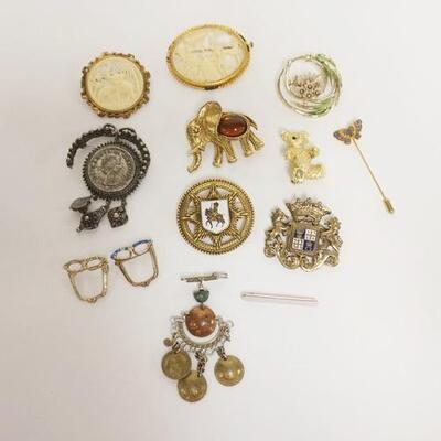 1332	12 BROOCHES AND A STICK PIN
