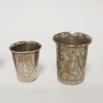 1238	GROUP OF 4 SMALL SILVER THIMBLES & 2 FOOTED SHOTS, ALL ARE ENGRAVED ON EXTERIOR W/ SCENES TALLEST IS 2 1/2 IN 
