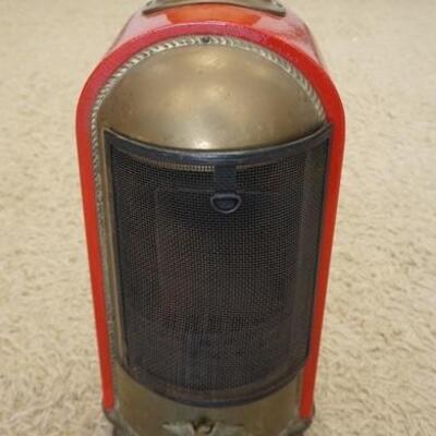 1293	UNUSUAL RED ENAMEL HEATER HAS A BRASS AMERICAN EAGLE ON THE LOWER FRONT. 27 IN H, 12 IN W, 9 IN DEEP
