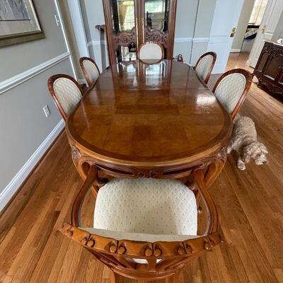 Century dining room table with 8 matching chairs and 2 leaves