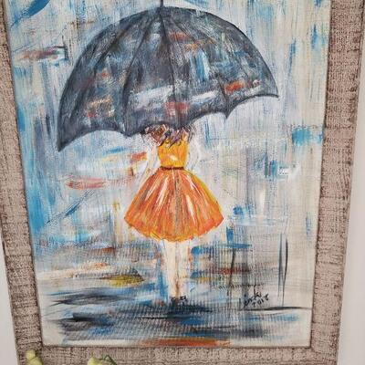 Nice painting of a girl with an umbrella, signed in the lower right corner