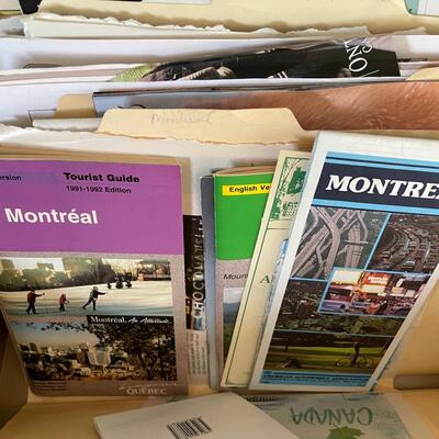 File cabinets filled with travel ephemera from all over the world