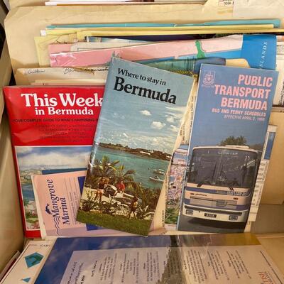 File cabinets filled with travel ephemera from all over the world