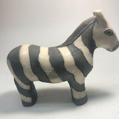 https://www.ebay.com/itm/124808691956	ME7021 South African Raku Pottery Zebra Figurine (small)
