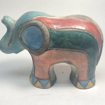 https://www.ebay.com/itm/114889038722	ME7009 South African Raku Pottery Elephant Figurine (light green head) (Large)
