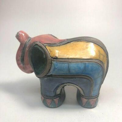 https://www.ebay.com/itm/124808631789	ME7004 South African Raku Pottery Elephant Figurine (red head)
