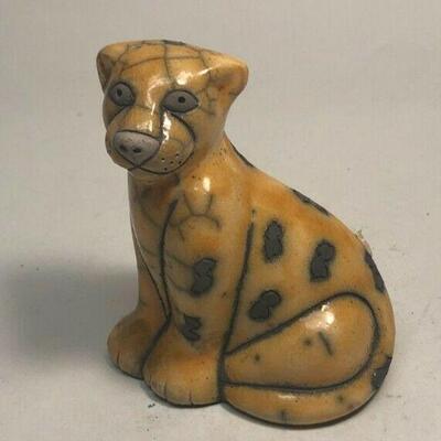 https://www.ebay.com/itm/124808685003	ME7014 South African Raku Pottery Cheetah Figurine (small)
