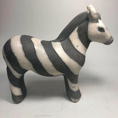 https://www.ebay.com/itm/124808690023	ME7018 South African Raku Pottery Zebra Figurine (large)
