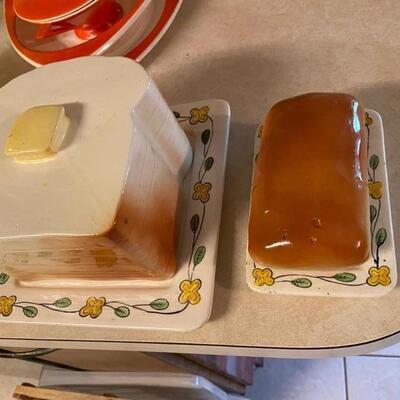 Stack of bread serving dish and loaf butter dish