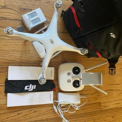 Phantom 4 Drone W/Controller, 2x Batteries, Charger, Propellers & DJI Backpack