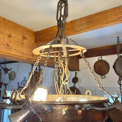 Very unique copper ceiling light with butcherâ€™s meat hanging hooks