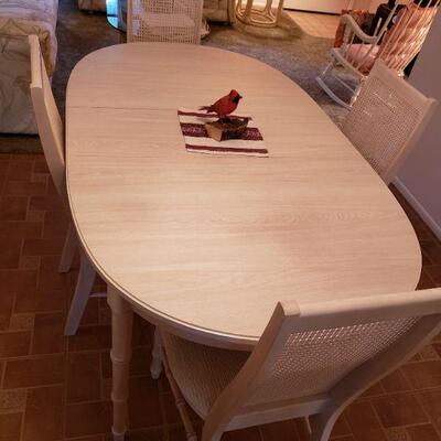 Dining room table and six chairs. Chairs look to be very seldom if ever used. Cloth seat and no stains or tears
