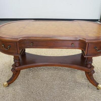 1138	HOOKER SEVEN SEAS LEATHER TOP DESK, WITH BRASS FEET AND CASTORS. 60 IN X 32 IN X 30 1/2 IN HIGH
