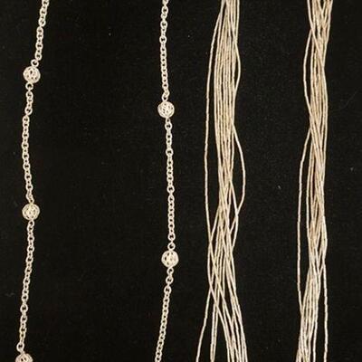 1117	2 NECKLACES, 1 MARKED STERLING SILVER. MULTI STRAND NECKLACE IS UNMARKED
