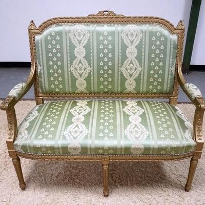 1159	CARVED UPHOLSTERED PAINT DECORATED ITALIAN SETTEE. 46 IN X 42 IN HIGH. HAS SOME STAINING ON UPHOLSTERY

