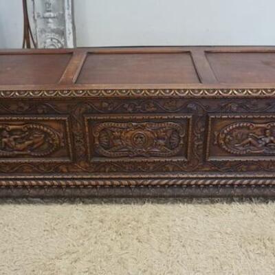 1135	HEAVILY CARVED BELGIAN BLANKET CHEST WITH LION HEADS, PEOPLE, ETC. 63 IN WIDE X 20 IN HIGH X 20 IN DEEP

